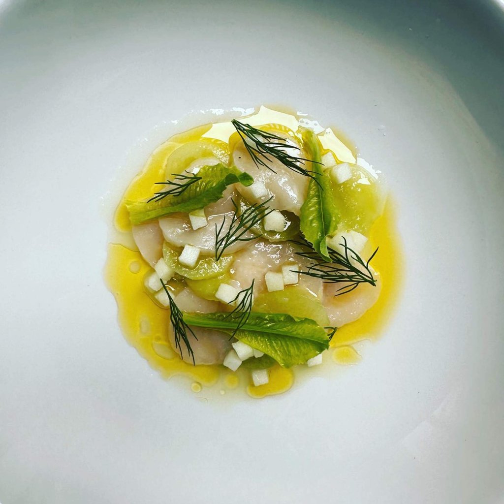 Scallop and celtuce at Restaurant 20 Victoria, one of two restaurants awarded their first Michelin star in the Toronto Michelin Guide 2023. Photo: Instagram/@twentyvictoria