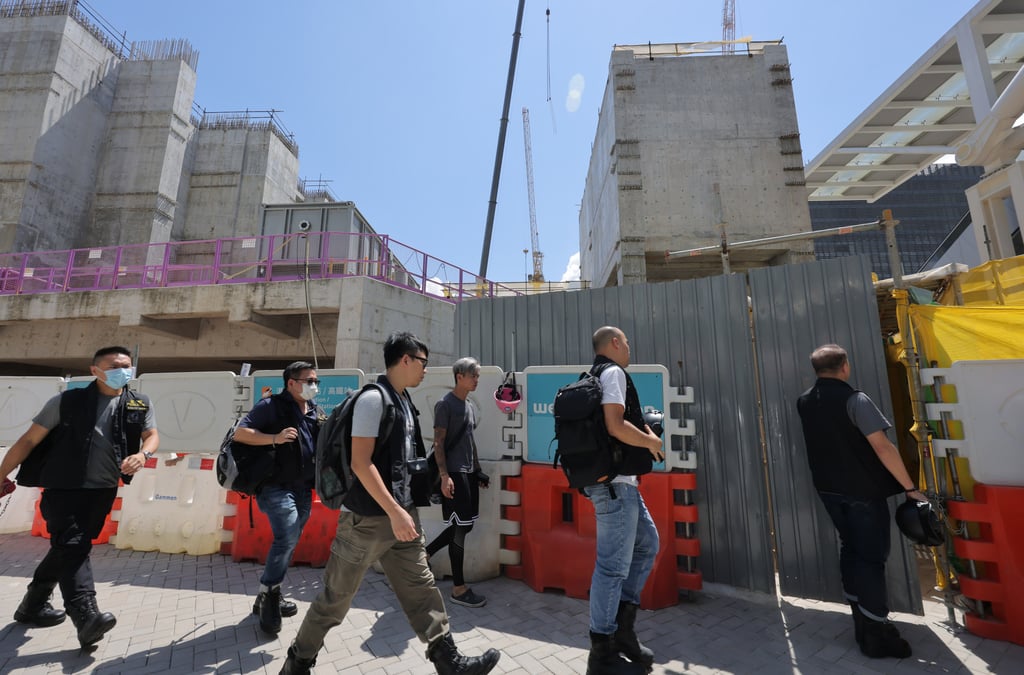 Police officers investigate the construction site where two trapped workers died in a biogas-filled underground tube. Photo: Jelly Tse