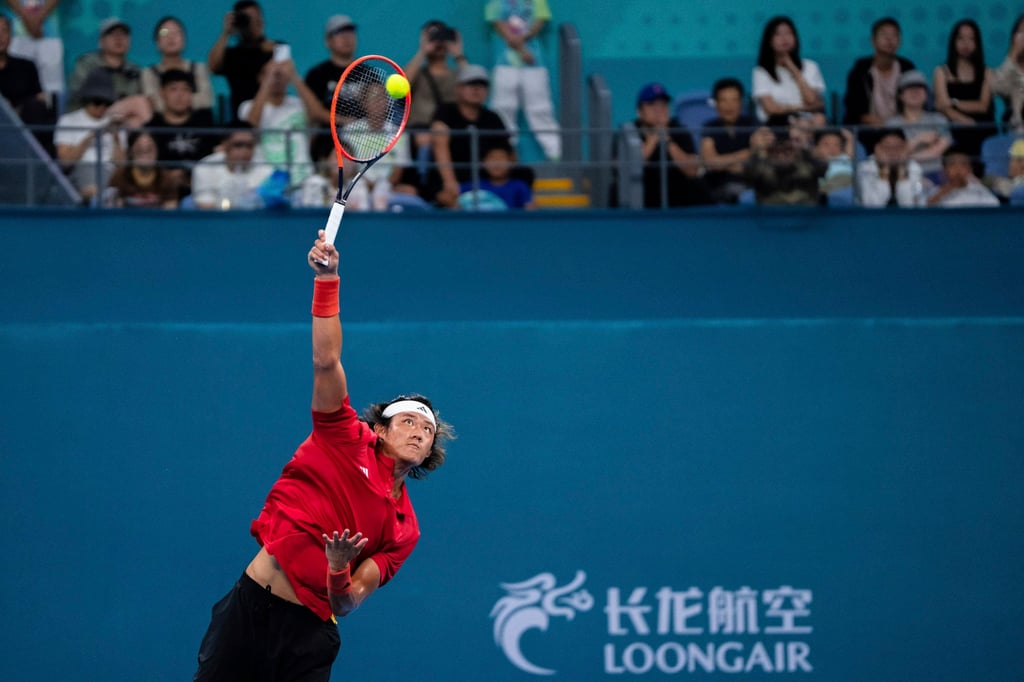 China’s Zhang Zhizhen serves during the men’s singles final in Hangzhou. Photo: AP China’s Zhang Zhizhen serves during the men’s singles final in Hangzhou. Photo: AP
