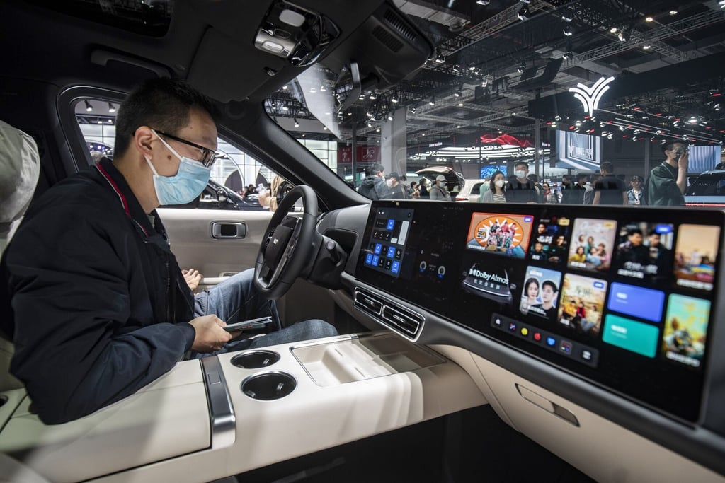 A visitor sits inside a Li Auto L9 SUV at the Shanghai Auto Show in April. Photo: Bloomberg