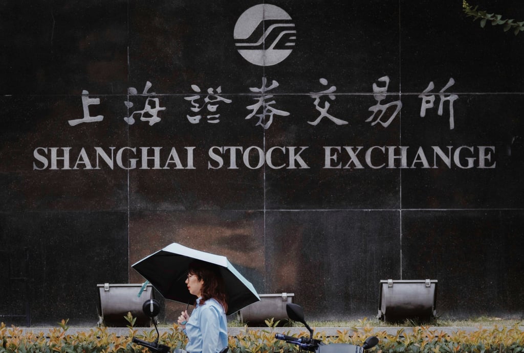 A woman walks past the Shanghai Stock Exchange building in Shanghai on August 21, 2023. Photo: EPA-EFE A woman walks past the Shanghai Stock Exchange building in Shanghai on August 21, 2023. Photo: EPA-EFE