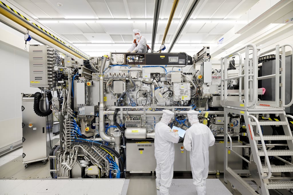 Employees are seen working on the final assembly of ASML’s TWINSCAN NXE:3400B semiconductor lithography tool with its panels removed, in Veldhoven, Netherlands, on April 4, 2019. Photo: Reuters Employees are seen working on the final assembly of ASML’s TWINSCAN NXE:3400B semiconductor lithography tool with its panels removed, in Veldhoven, Netherlands, on April 4, 2019. Photo: Reuters