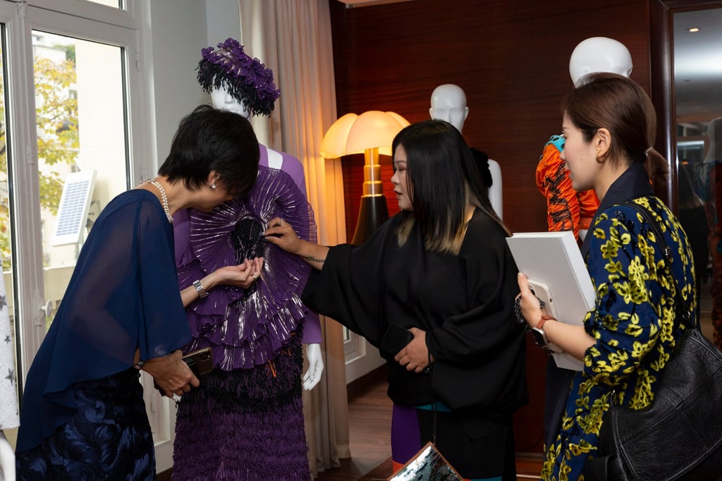 Guests get up close and personal with Chinese designers’ work at the Yu Prize cocktail reception. Photo: Yu Holdings