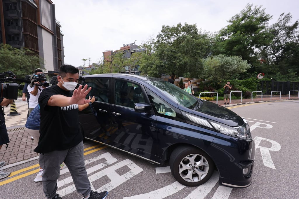 Police impound a car in a latest arrest linked to the JPEX scandal. Photo: May Tse