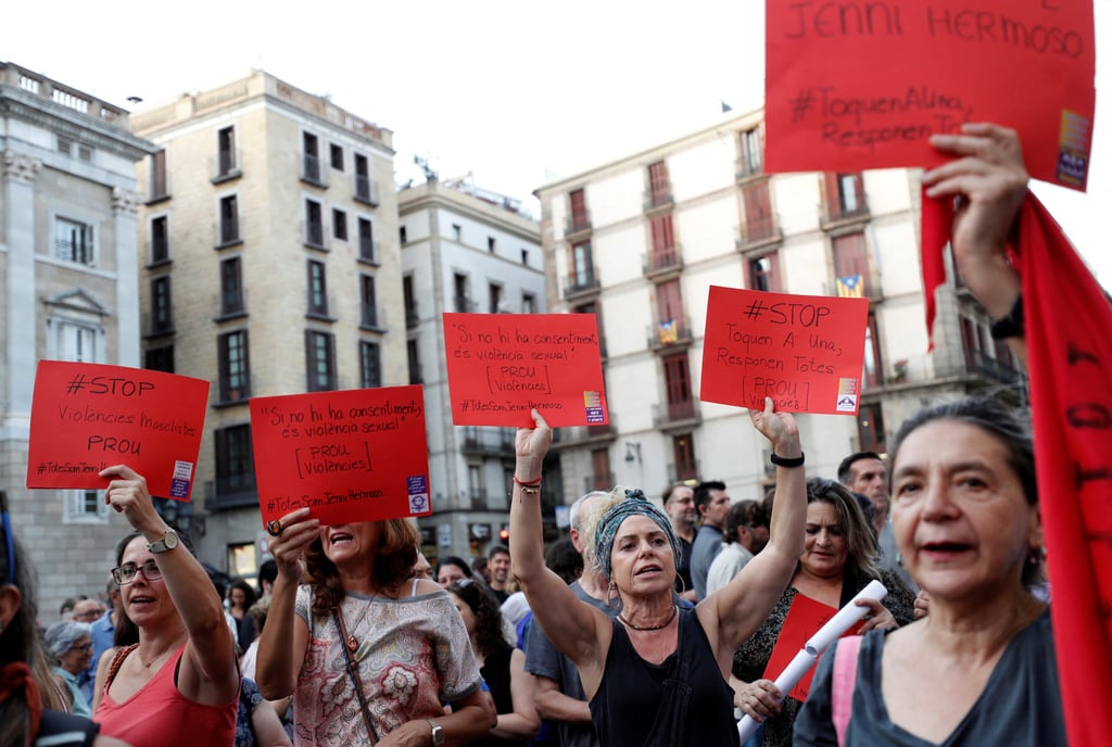 Women hold placards, in a reference to red cards in football, that read “Stop Violence against Women” during a protest against Spanish football chief Luis Rubiales in Barcelona in September. Photo: Reuters