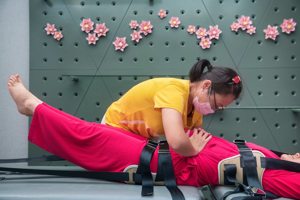 A new mother exercises to tighten her stomach in the Hangzhou postnatal centre. Photo: Justin Jin A new mother exercises to tighten her stomach in the Hangzhou postnatal centre. Photo: Justin Jin