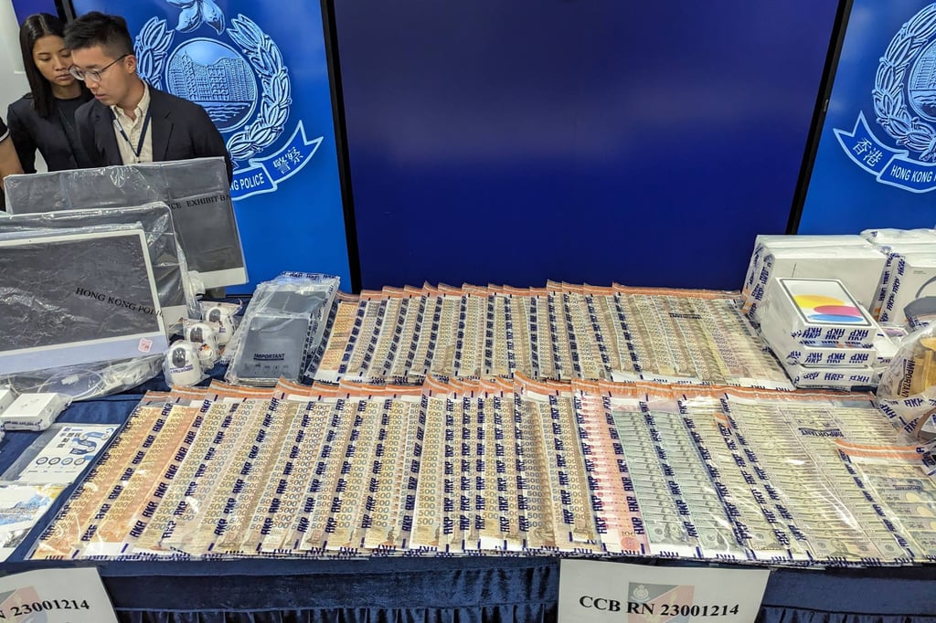Hong Kong police display seized cash, computer equipment, luxury handbags and promotional leaflets at a press conference on September 19, 2023, regarding the initial arrests of people with ties to cryptocurrency platform JPEX. Photo: Agence France-Presse Hong Kong police display seized cash, computer equipment, luxury handbags and promotional leaflets at a press conference on September 19, 2023, regarding the initial arrests of people with ties to cryptocurrency platform JPEX. Photo: Agence France-Presse