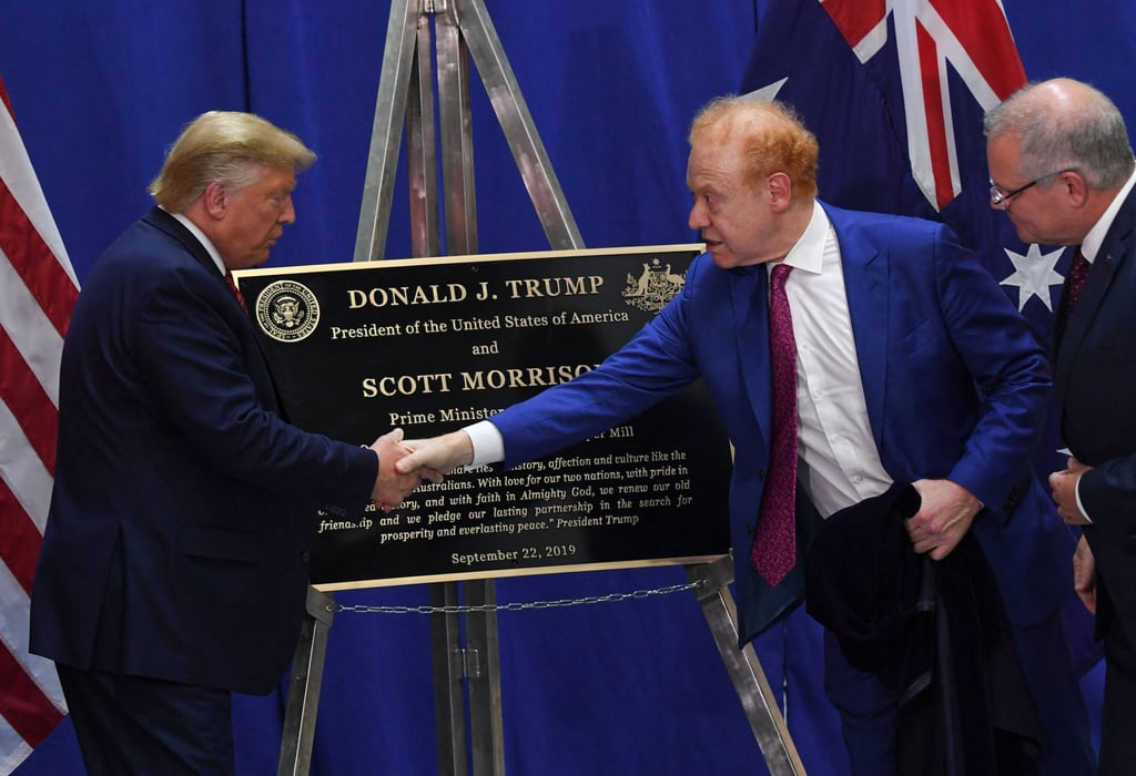 US President Donald Trump (left) shakes hands with businessman Anthony Pratt as Australian Prime Minister Scott Morrison looks on during a visit to a Pratt Industries plant opening in Wapakoneta, Ohio, in September 2019. Photo: AFP