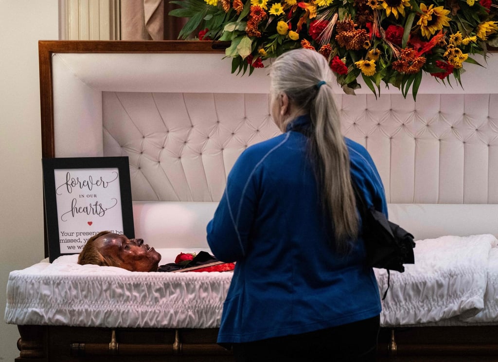 A woman visits the body of “Stoneman Willie” during his funeral service in Reading, Pennsylvania, on Saturday. Photo: AFP A woman visits the body of “Stoneman Willie” during his funeral service in Reading, Pennsylvania, on Saturday. Photo: AFP