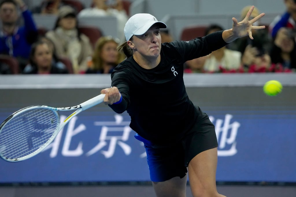 Iga Swiatek returns a shot during the final on the Diamond Court in Beijing. Photo: AP