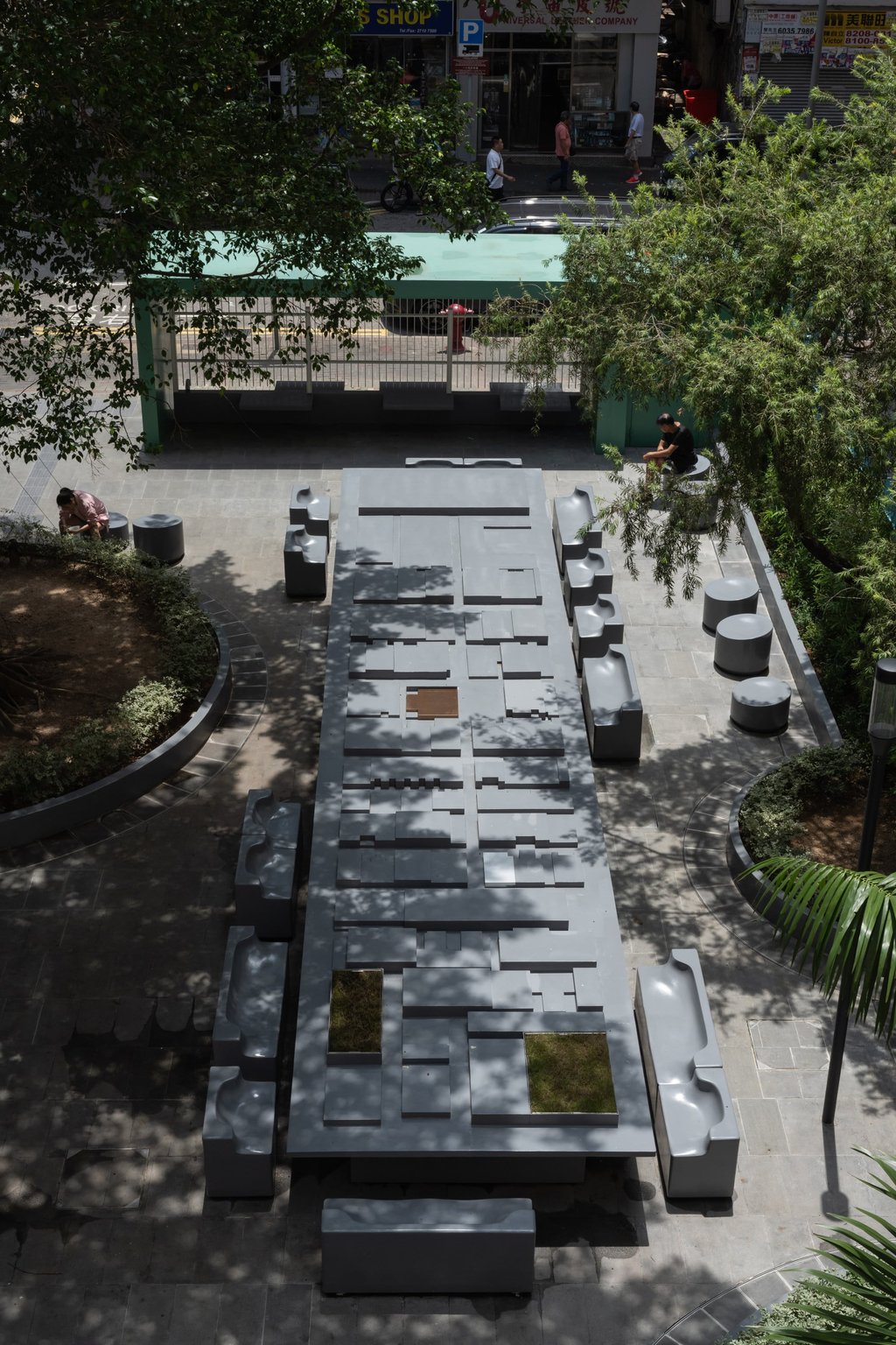 Hamilton Street Rest Garden’s 30-square-metre aDapTable is an abstraction of the urban topography that surrounds the park, and contains space for takeaway boxes, books, newspapers and laptops. Photo: Design Trust