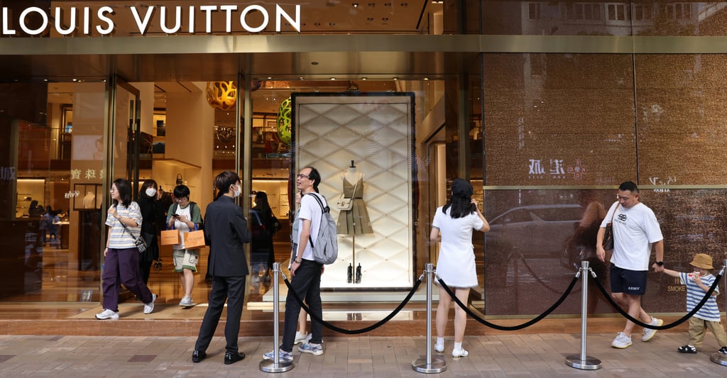 Shoppers line up outside the Louis Vuitton shop on Canton Road in Tsim Sha Tsui, Hong Kong, on September 28. Photo: Yik Yeung-man Shoppers line up outside the Louis Vuitton shop on Canton Road in Tsim Sha Tsui, Hong Kong, on September 28. Photo: Yik Yeung-man