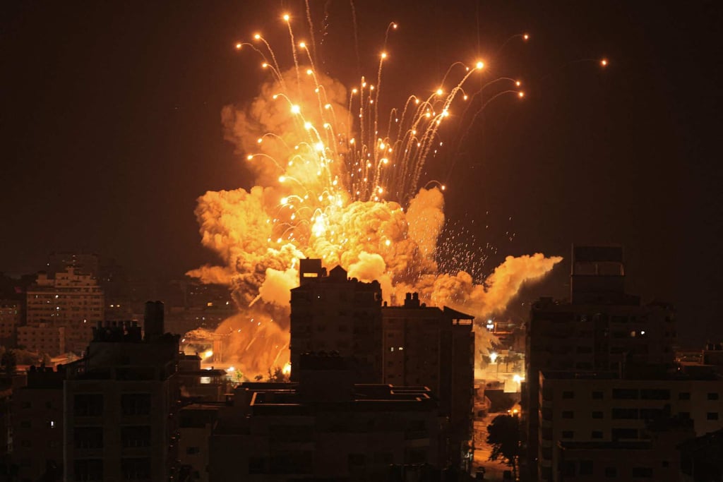 A missile explodes in Gaza City during an Israeli air strike. Photo: AFP