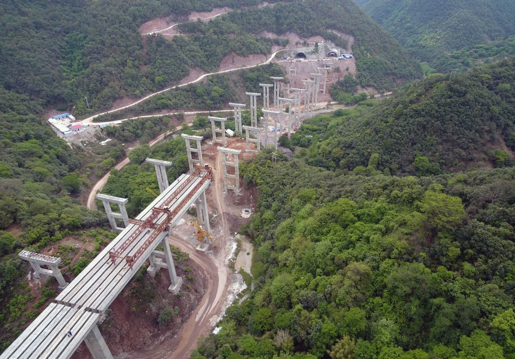 China’s Yunnan province has issued bonds to finance the construction of infrastructure projects like the 2.06km long Chahe grand bridge to boost the local economy. Photo: Xinhua
