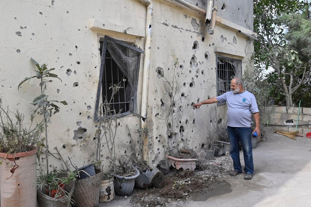 A man looks at a wall house that was hit by Israeli shelling in a village in south Lebanon on Tuesday. Photo: EPA-EFE A man looks at a wall house that was hit by Israeli shelling in a village in south Lebanon on Tuesday. Photo: EPA-EFE