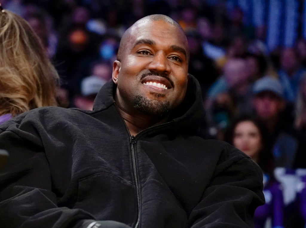 Kanye West, known as Ye, watches the first half of an NBA basketball game between the Washington Wizards and the Los Angeles Lakers in Los Angeles, US, in March 2022. Photo: AP Photo