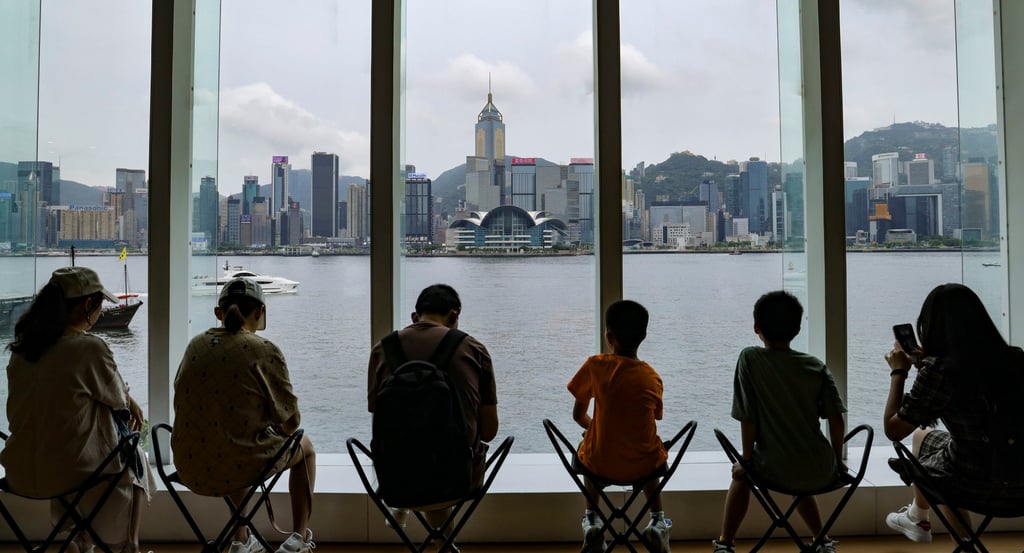 Tourists enjoy the view of Victoria Harbor from the window at the Hong Kong Museum of Arts in Tsim Sha Tsui. Photo: Jelly Tse Tourists enjoy the view of Victoria Harbor from the window at the Hong Kong Museum of Arts in Tsim Sha Tsui. Photo: Jelly Tse