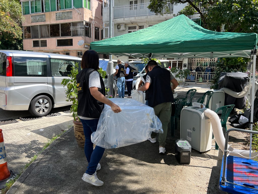 Police collect evidence from the crime scene in Tai Po’s Lung Mei Tsuen villages. Photo: Handout