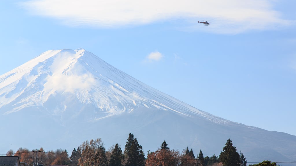 A helicopter flying near Mount Fuji. Blank Marketing & Management’s Airc app enables on-demand helicopter flights between various locations in Japan. Photo: Shutterstock A helicopter flying near Mount Fuji. Blank Marketing & Management’s Airc app enables on-demand helicopter flights between various locations in Japan. Photo: Shutterstock
