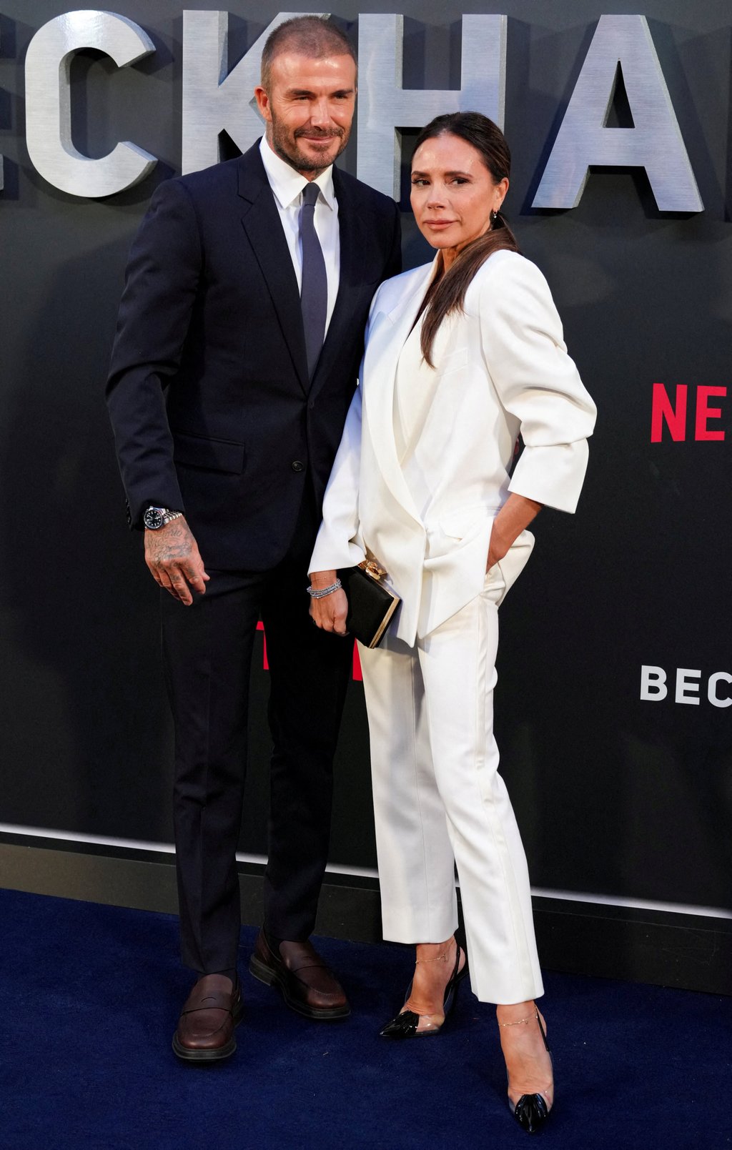 12 of Victoria and David Beckham s best couple looks ever from those 90s Gucci biker fits to Dior Homme and Posh s label at Harry and Meghan s wedding to matching suits at the