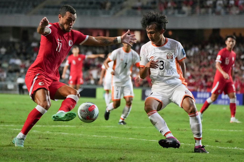 Everton Camargo (left) takes on the Bhutan defence in a convincing win at Hong Kong Stadium. Photo: Elson Li