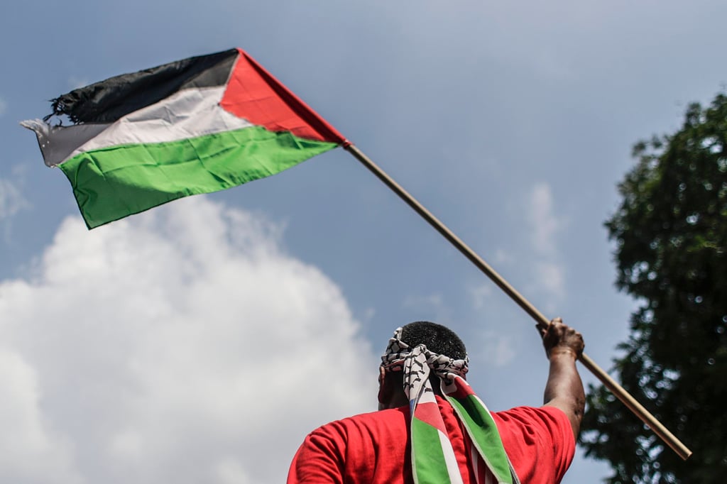 A protester holds a Palestinian flag outside the US embassy in Kuala Lumpur during a 2017 rally against Washington’s decision to recognise Jerusalem as capital of Israel. Photo: EPA-EFE