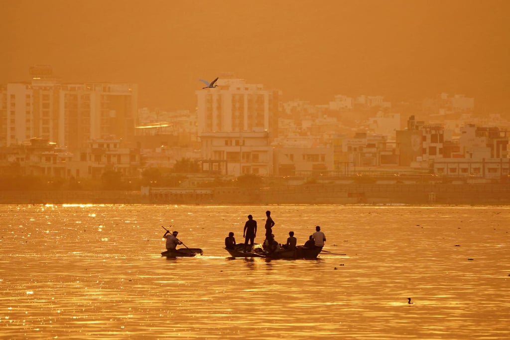 Fishermen seen at sunset on a lake in Rajasthan, one of five Indian states heading to the polls soon. Photo: AFP
