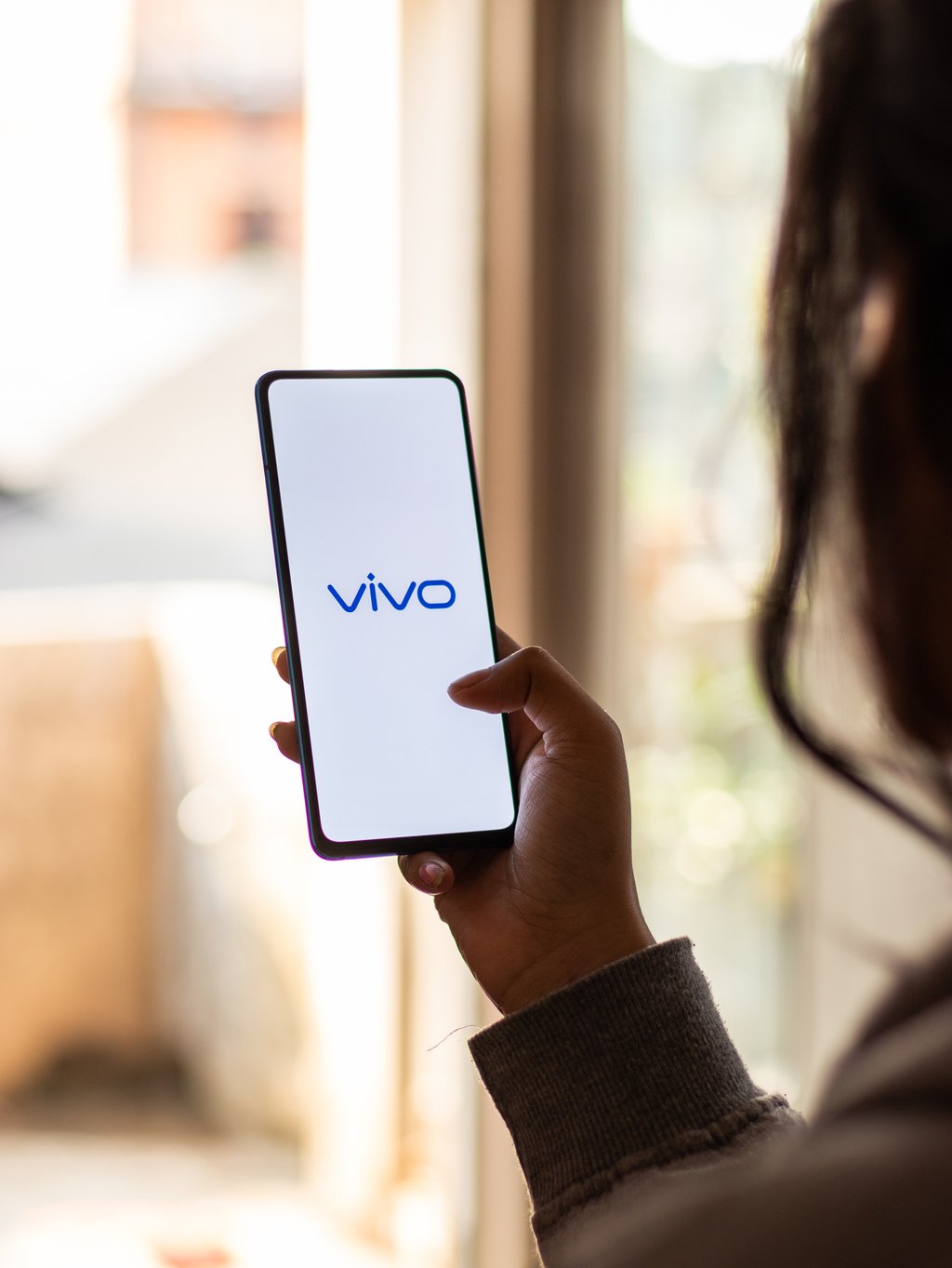 A Vivo smartphone user is seen in Assam, a state in northeastern India, on January 15, 2020. Photo: Shutterstock A Vivo smartphone user is seen in Assam, a state in northeastern India, on January 15, 2020. Photo: Shutterstock