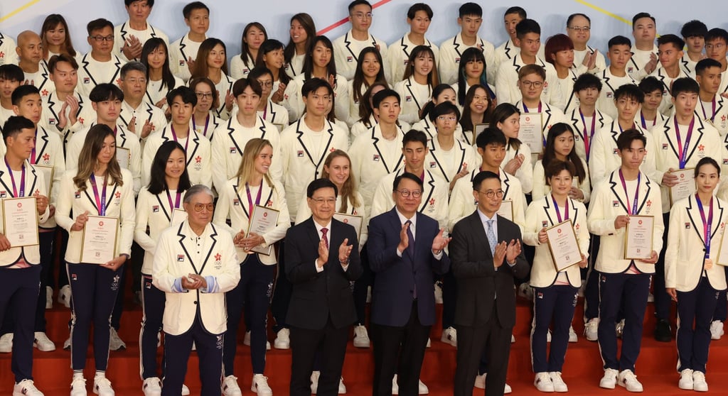 (From left) Fok, Lee, Chief Secretary Eric Chan Kwok-ki and Kevin Yeung pose with the athletes. Photo: Yik Yeung-man (From left) Fok, Lee, Chief Secretary Eric Chan Kwok-ki and Kevin Yeung pose with the athletes. Photo: Yik Yeung-man