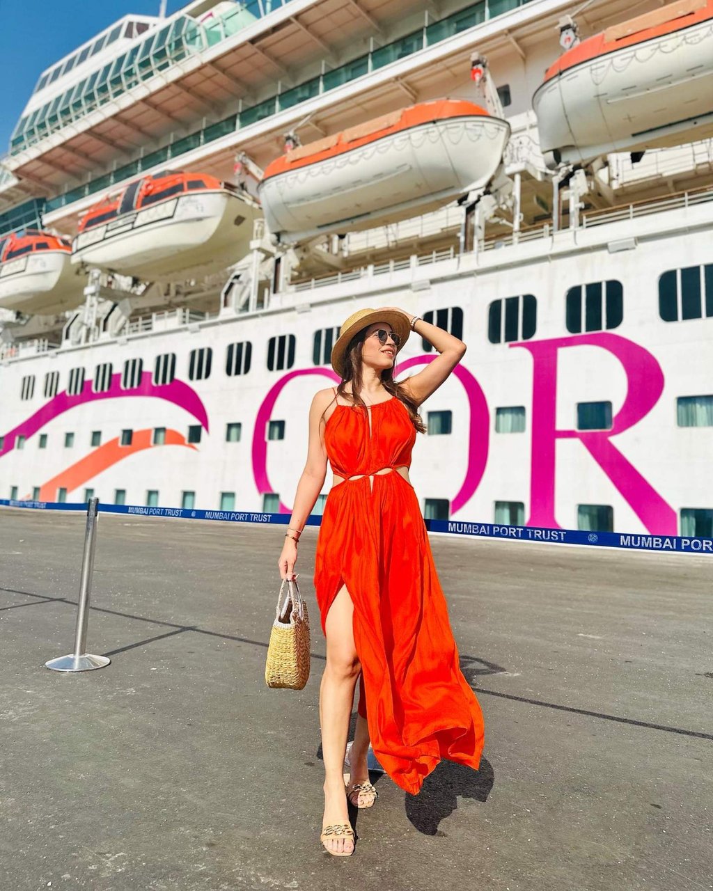 An Indian guest poses in front of the Cordelia Cruises ship Empress in Mumbai Port, India. Photo: Instagram/@kanika_kh An Indian guest poses in front of the Cordelia Cruises ship Empress in Mumbai Port, India. Photo: Instagram/@kanika_kh