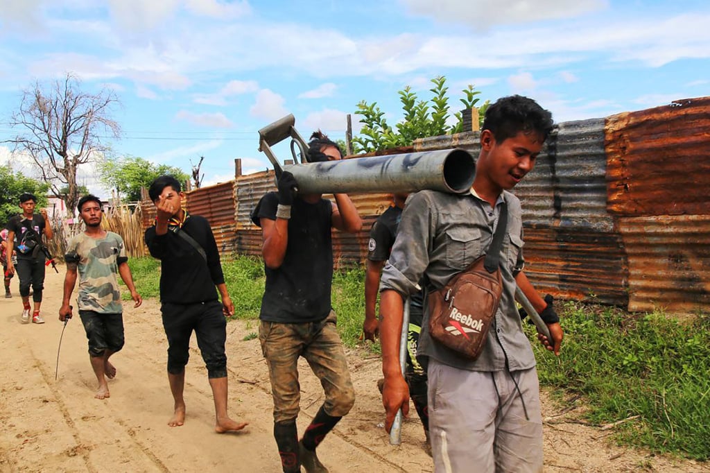 Anti-coup fighters walking with weapons in a township in Myanmar’s northwestern Sagaing region in August 2022. Photo: AFP Anti-coup fighters walking with weapons in a township in Myanmar’s northwestern Sagaing region in August 2022. Photo: AFP