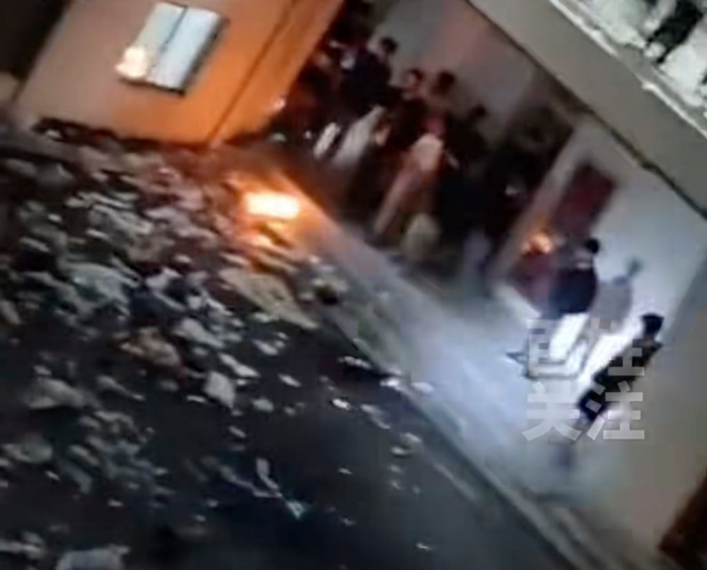 Furious students littered the campus with paper and clothes before lighting small fires. Photo: Douyin Furious students littered the campus with paper and clothes before lighting small fires. Photo: Douyin