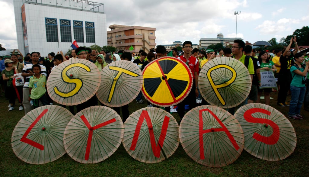 Malaysian protesters display umbrellas with words reading “Stop Lynas” during a protest against a rare earth refinery being built by Australian miner Lynas amid fears of radioactive pollution. Photo: AP