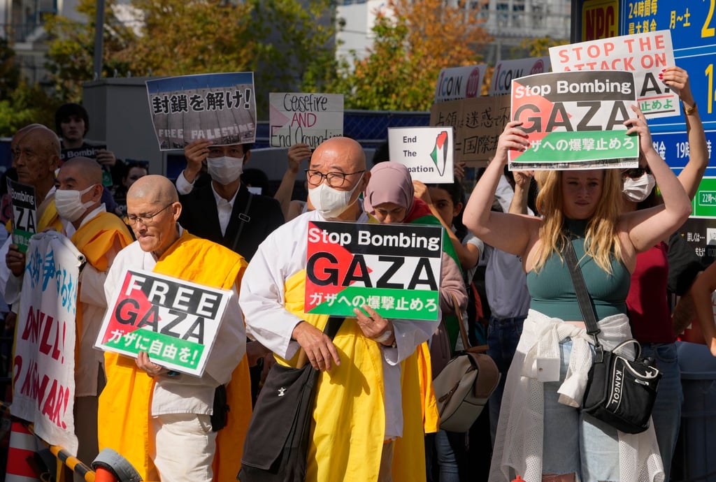 People hold banners during a rally against Israel’s military operations in Gaza near the embassy of Israel in Tokyo, Japan, on Saturday. Photo: EPA-EFE