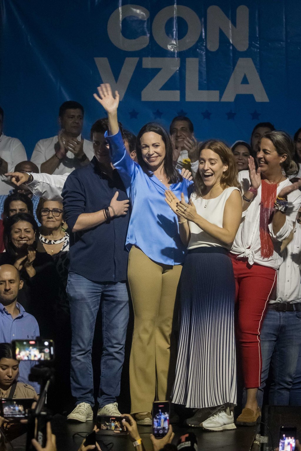 Maria Corina Machado, centre, celebrates the primary election results in Caracas, Venezuela on Monday. Photo: EPA-EFE