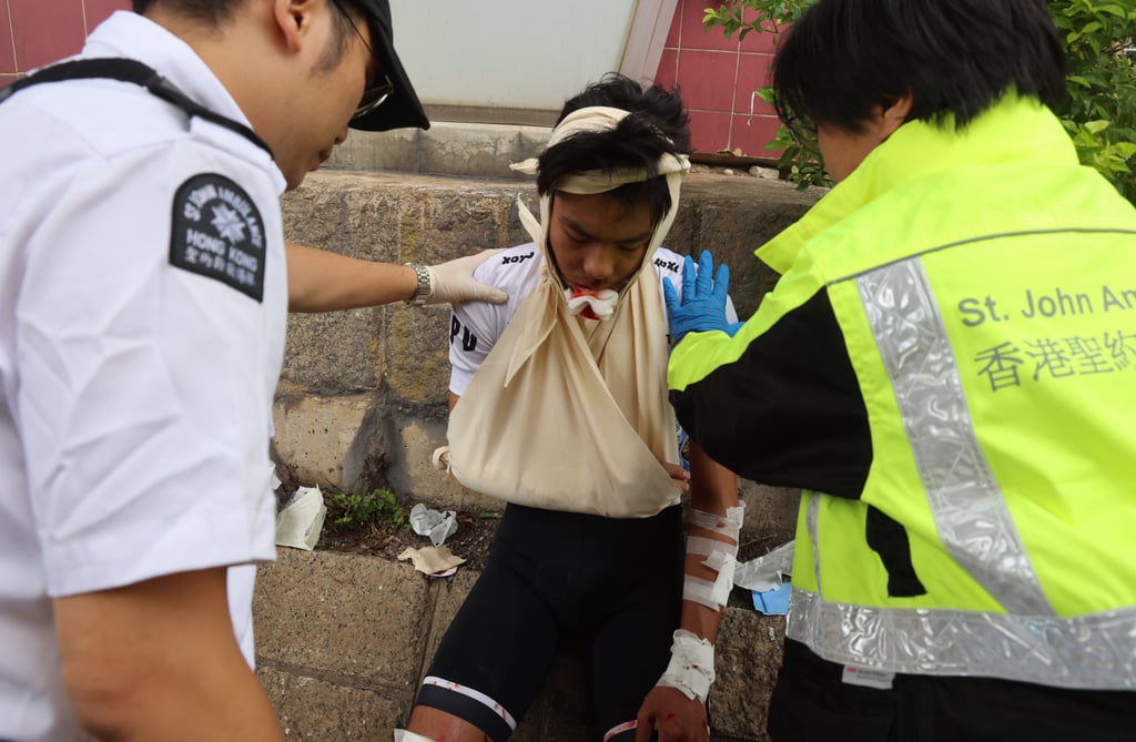 An injured cyclist is tended to at the Cyclothon on Sunday. Photo: Dickson Lee An injured cyclist is tended to at the Cyclothon on Sunday. Photo: Dickson Lee