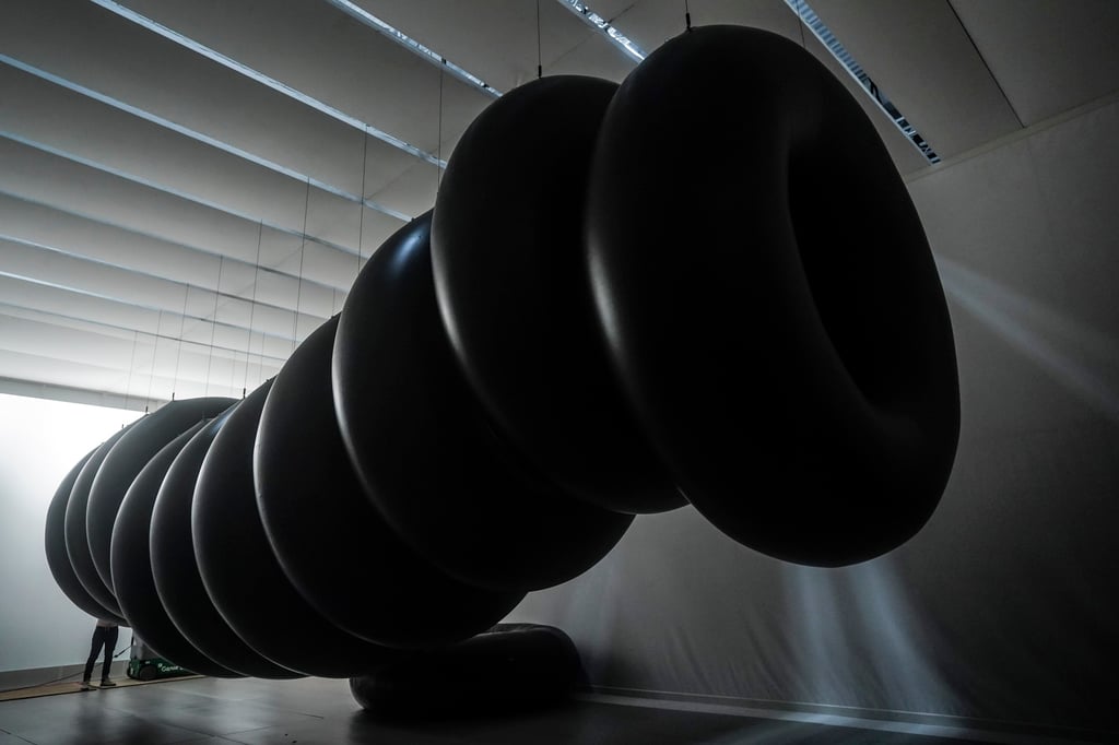 “Zeros” by SpY is an inflatable kinetic sculpture of tubes. Photo: AP