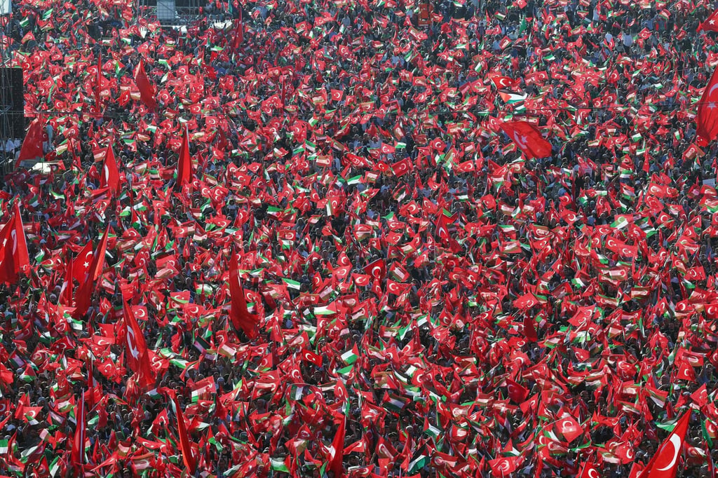 Supporters wave Turkish and Palestinian flags as Turkish President Recep Tayyip Erdogan speaks during a rally in Istanbul on Saturday. Photo: Turkish Presidency Press Office via AFP Supporters wave Turkish and Palestinian flags as Turkish President Recep Tayyip Erdogan speaks during a rally in Istanbul on Saturday. Photo: Turkish Presidency Press Office via AFP