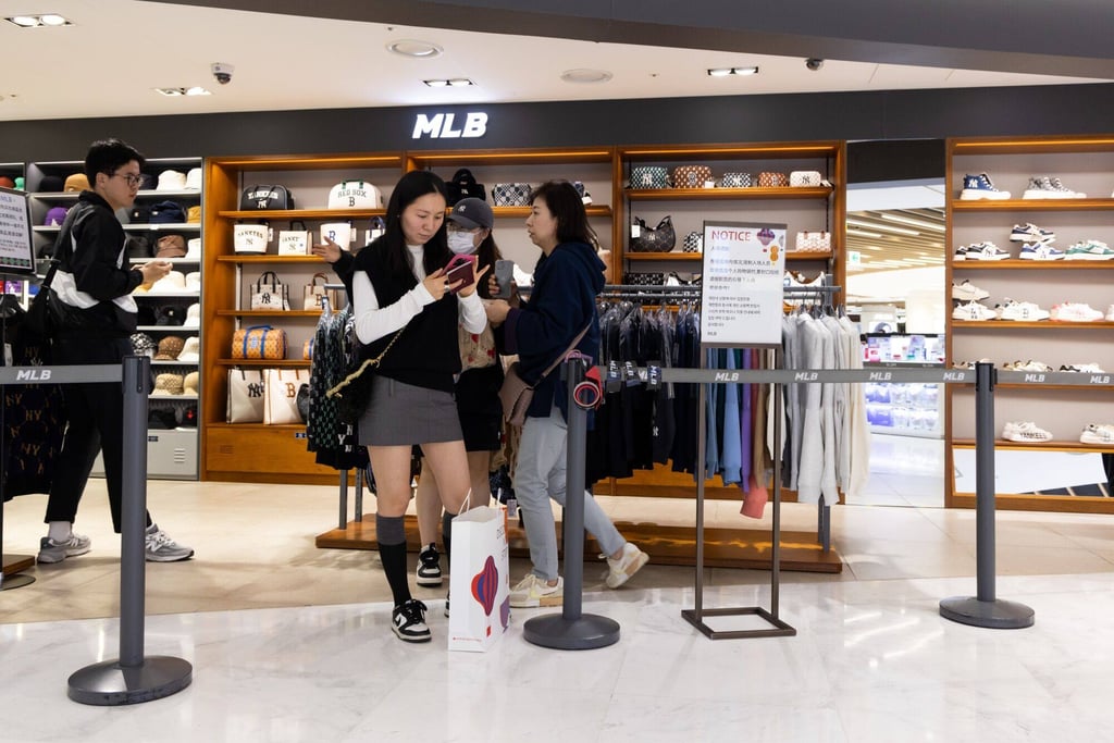 Chinese tourists at the MLB clothing store inside a duty free store in Seoul. Photo: Bloomberg