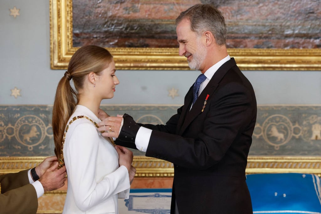Spanish Crown Princess of Asturias Leonor receives the Spanish Order of Charles III collar from Spain’s King Felipe VI at the Royal Palace in Madrid on Tuesday. Photo: AFP