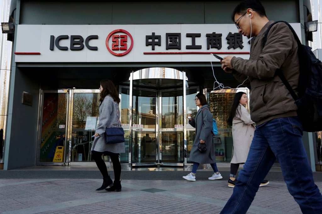 People walk past a branch of Industrial and Commercial Bank of China (ICBC) in Beijing, China April 1, 2019. Photo: Reuters