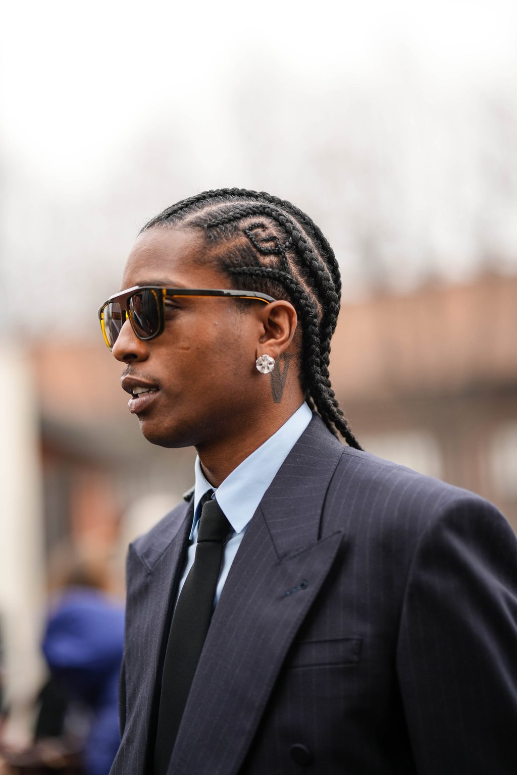 A$AP Rocky sporting his distinctive “Gucci” braids during the Milan Fashion Week womenswear autumn/winter 2023/2024 event on February 24. Photo: Getty Images
