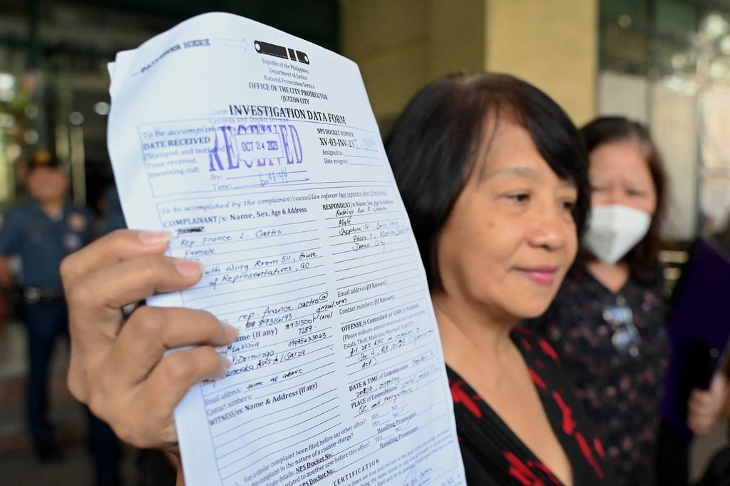 Philippine legislator France Castro shows a document after filing a criminal complaint against former Philippine president Rodrigo Duterte following the malicious threats made by Duterte in a television interview. Photo: AFP Philippine legislator France Castro shows a document after filing a criminal complaint against former Philippine president Rodrigo Duterte following the malicious threats made by Duterte in a television interview. Photo: AFP