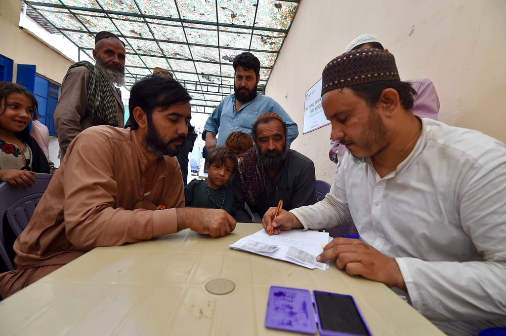 Afghan refugees get registered for verification, in Karachi, Pakistan, on Friday. Photo: EPA-EFE