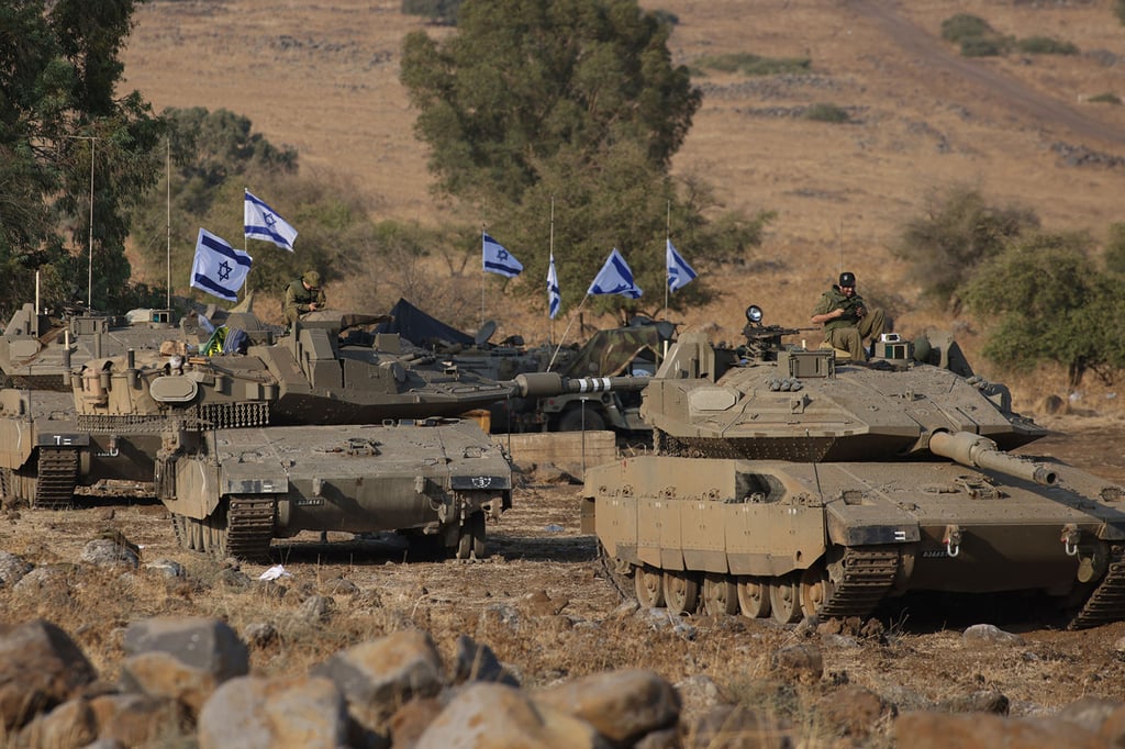 Israeli Merkava tanks are positioned in the upper Galilee in northern Israel near the border with Lebanon on October 11. Photo: TNS Israeli Merkava tanks are positioned in the upper Galilee in northern Israel near the border with Lebanon on October 11. Photo: TNS
