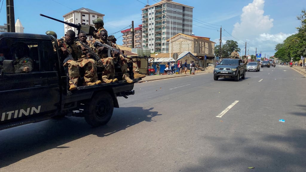 Guinean security forces patrol the streets after former leader Moussa Dadis Camara was sprung from prison in Conakry on Saturday. Photo: Reuters Guinean security forces patrol the streets after former leader Moussa Dadis Camara was sprung from prison in Conakry on Saturday. Photo: Reuters