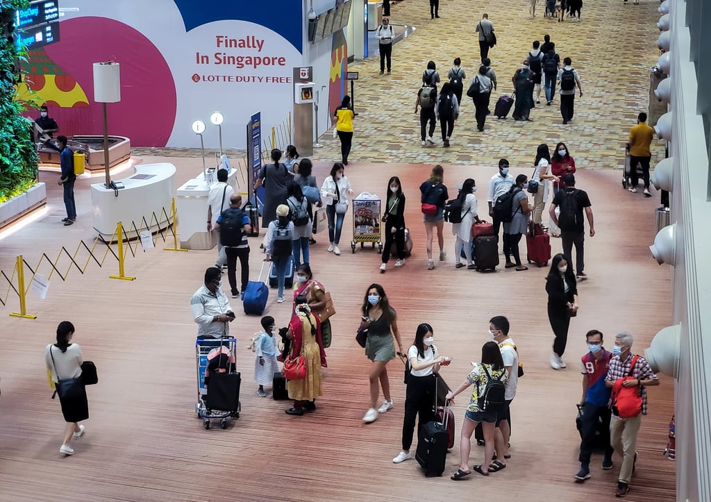 Travellers walk through the transit area of Changi Airport in SIngapore. Photo: Getty Images