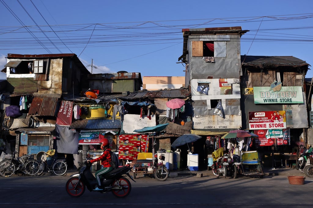 A man rides a motorcycle in a slum in Manila. While the Asia-Pacific is forecast to contribute to two-thirds of global economic growth this year, it is “not on track” to achieve any of the UN’s 17 Sustainable Development Goals by the 2030 deadline. Photo: dpa A man rides a motorcycle in a slum in Manila. While the Asia-Pacific is forecast to contribute to two-thirds of global economic growth this year, it is “not on track” to achieve any of the UN’s 17 Sustainable Development Goals by the 2030 deadline. Photo: dpa