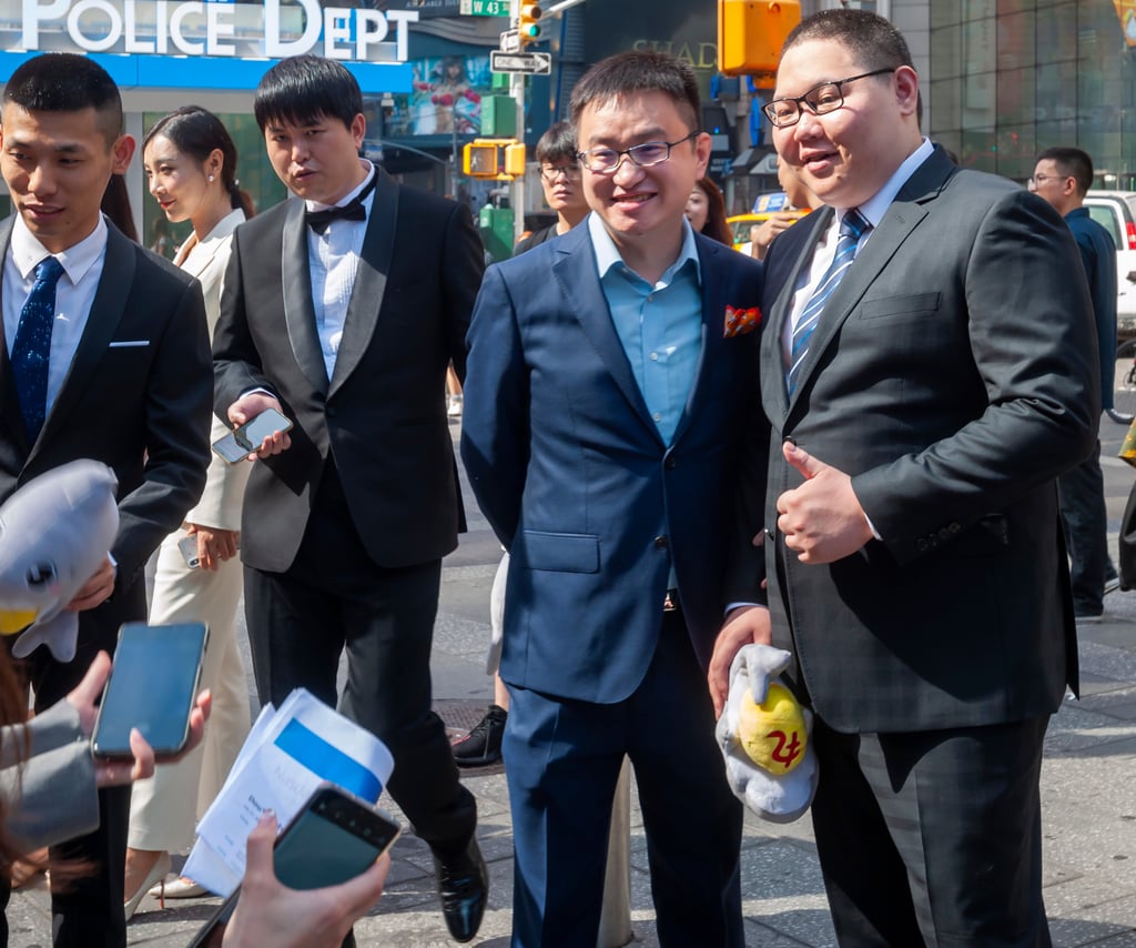 Douyu International Holdings founder and chief executive Chen Shaojie, third from left, poses for pictures next to Chinese video-gaming live streamer Liu Mou outside the Nasdaq stock exchange in New York City during the company’s initial public offering on July 17, 2019. Photo: Shutterstock