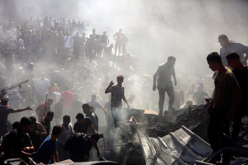 Palestinians inspect the rubble of destroyed buildings following Israeli air strikes on the southern Gaza Strip late last month. Photo: AP Palestinians inspect the rubble of destroyed buildings following Israeli air strikes on the southern Gaza Strip late last month. Photo: AP